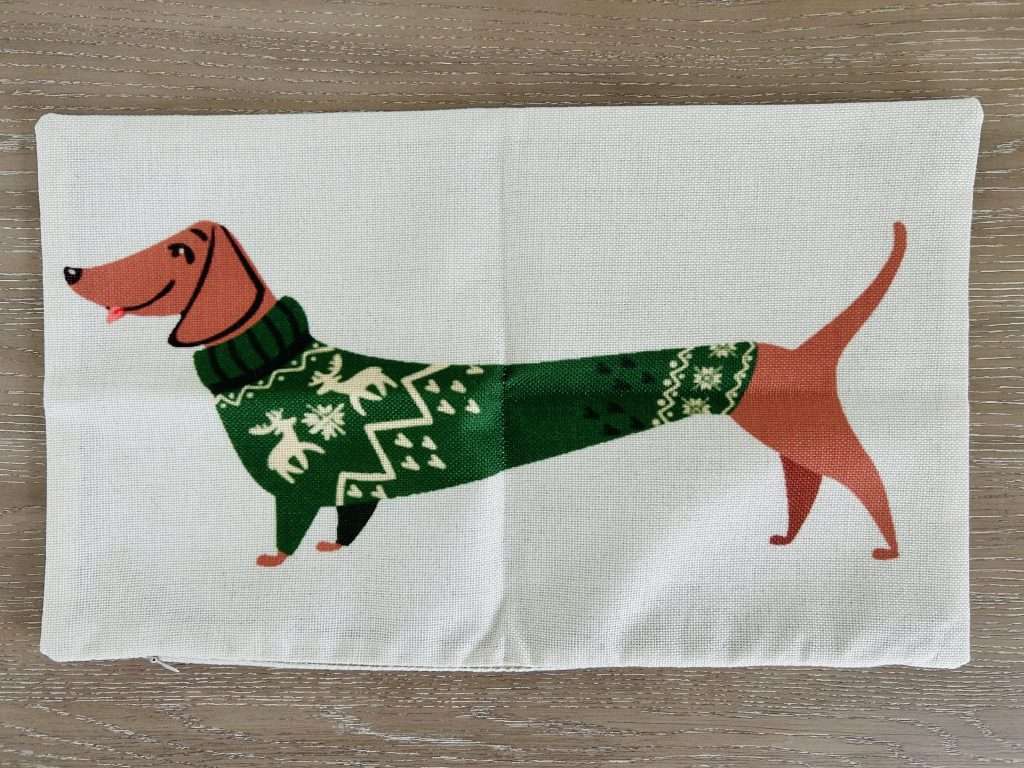 throw pillow cover with a dachshund wearing a sweater