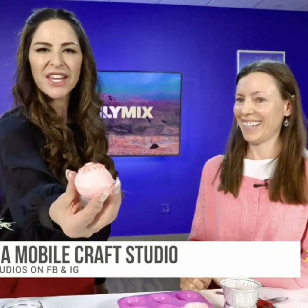 Nicole Bolin of Stencil on the AZ Daily Mix with Teresa holding a white chocolate easter bomb