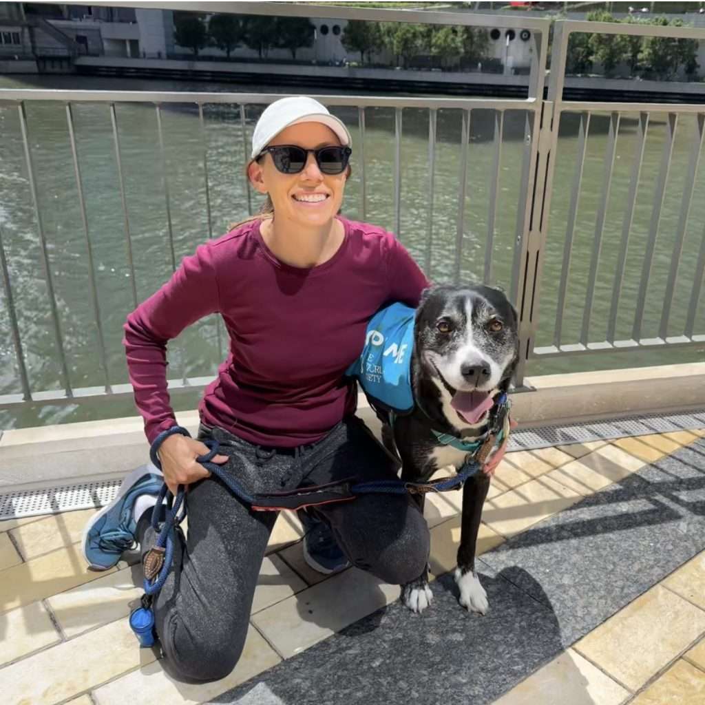 woman posing with a dog from an animal shelter
