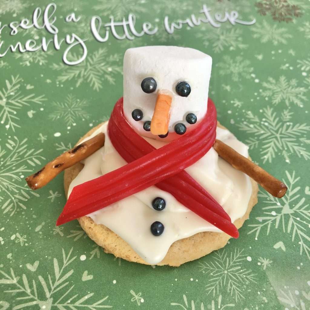 melted snowman cookie with pretzel arms