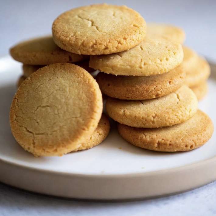 stack of sugar cookies on a plate